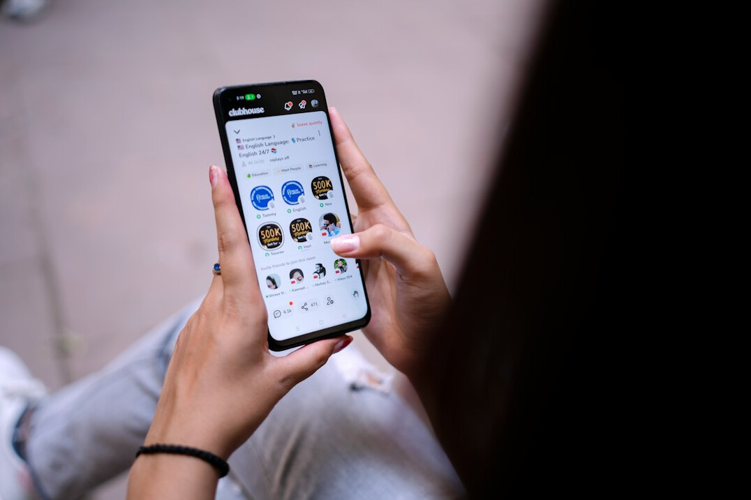 person scrolling on smartphone